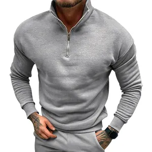 Macro view of grey men's half-zip pullover sweatshirt with stand collar detail