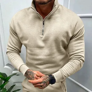Detail of men's solid color half-zip sweatshirt with a polo collar and fleece lining.