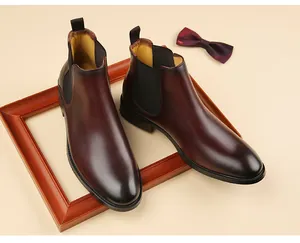 Detailed view of high-quality brown leather Chelsea boots for men with a sleek finish