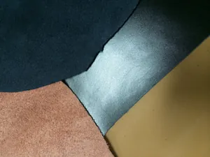 Macro detail view of high-quality genuine leather swatches in various textures and colors