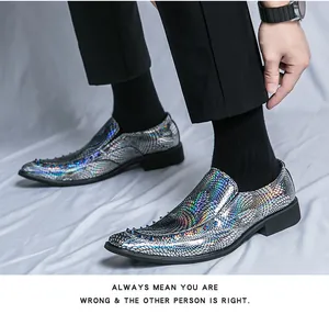 Detail shot of iridescent holographic loafers featuring spiked toe and scale pattern