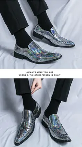 Close-up detail view of silver holographic loafers with rivets and scale texture