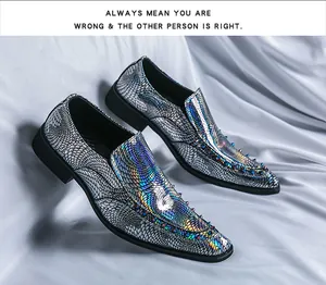Macro detail of iridescent metallic loafers with decorative rivets on a draped background.