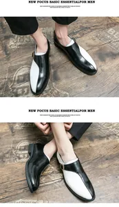 Dettaglio ravvicinato di scarpe eleganti bicolore bianco e nero da uomo con fibbia laterale.