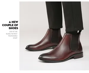 Close-up of premium burgundy leather Chelsea boots with elastic side panels for men