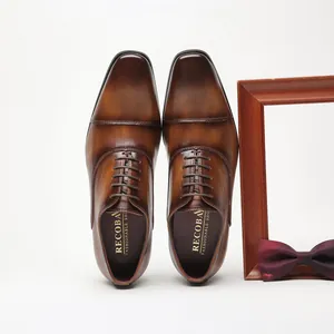 Men's brown leather Oxford shoes with cap toe design for business and wedding.