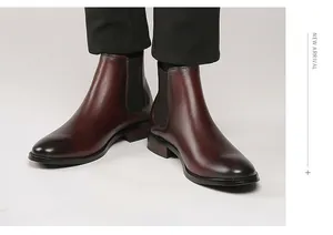 Detailed view of premium dark red leather men's Chelsea boots with elastic side