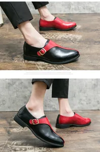 Dettaglio ravvicinato di eleganti scarpe da uomo a punta in pelle nera e rossa