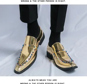 Detailed on-foot view of gold metallic pointed-toe loafers featuring colorful decorative studs
