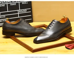 Detailed view of hand-burnished leather brogue oxford shoes with wingtip detailing