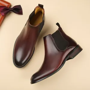 Classic men's burgundy leather Chelsea boots with elastic side panels in British style.