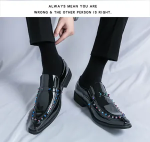 Detailed macro shot of black patent leather loafers featuring colorful metallic spikes