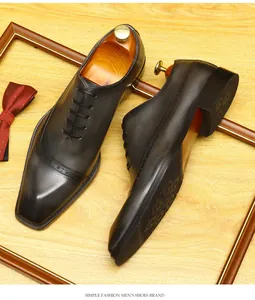 Detailed view of premium brown leather brogue oxford shoes for men with carvings