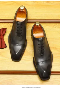 Detailed top view of brown brogue oxford shoes with decorative carving