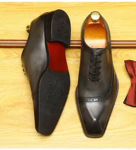 Detailed view showing the top and textured sole of men's handcrafted brown Brogue Oxford shoes.