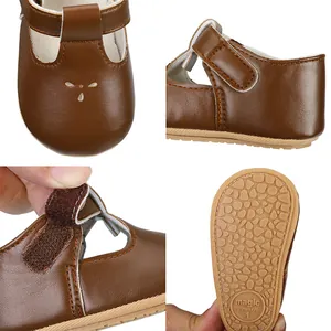 Detailed view of brown baby prewalker shoes showing Velcro strap and non-slip sole.