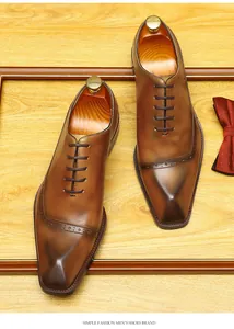 Premium hand-burnished brown leather Oxford shoes with brogue carving and square toe design.