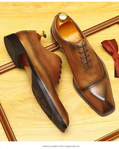 Detailed view of brown hand-burnished leather Brogue Oxford shoes for men.