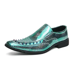 Stylish emerald green scale-patterned loafers with metallic studs in shiny patent leather