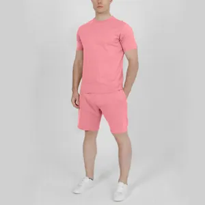 Professional studio shot of a male model wearing a solid pink men's summer short sleeve set