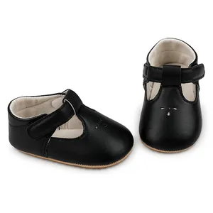 Detailed view of black faux leather baby Mary Jane walking shoes from two angles