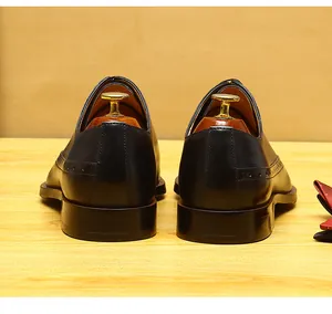 Close-up rear view of black men's brogue leather shoes with elegant business design