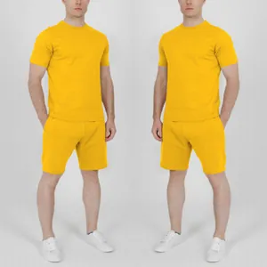 Front view of two identical men's yellow summer sports sets with short sleeves and shorts