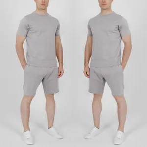 Casual men's summer outfit set featuring a solid grey short-sleeved t-shirt and shorts