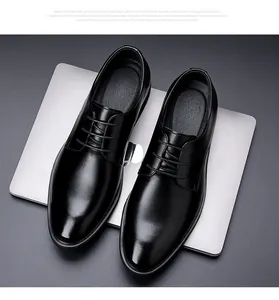 Classic black leather dress shoes for men, business formal style, top view detail