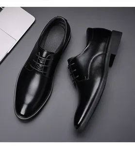 Elegant black leather business dress shoes for men with a lace-up design for formal events