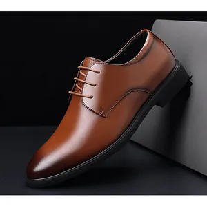 Detail of brown business dress shoe showing smooth leather finish and fine stitching.