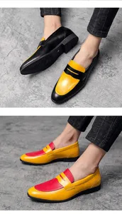 Detail view of men's trendy patchwork loafers in black, yellow, and red colors