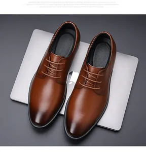 Top down detailed view of elegant brown men's leather business dress shoes with laces