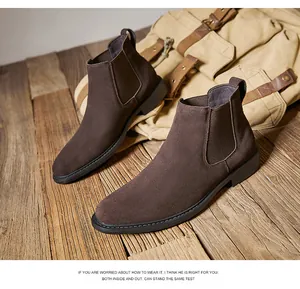 Detail view of brown suede Chelsea boots for men with classic elastic side panels