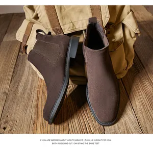 Premium brown suede Chelsea boots for men displayed against a rustic canvas backdrop