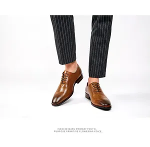 Detailed shot of men's brown hand-rubbed leather brogues with carved wingtip details