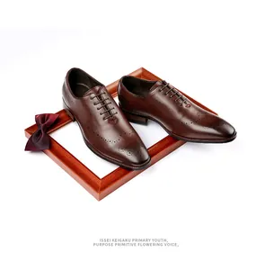 Elegant hand-burnished brown leather brogue oxfords for men displayed on a wooden frame.