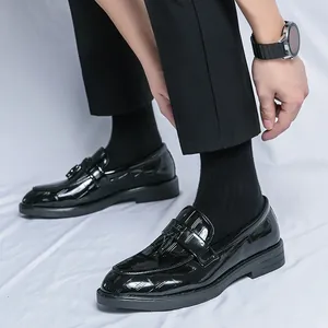 Men's glossy patent leather loafers with tassels and embossed pattern for formal wear