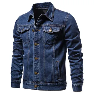 Close-up detail of a premium slim fit men's blue denim jacket with vintage copper buttons