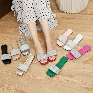 Pearl embellished square-toe flat slide sandals in various colors shown on model