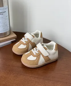 Stylish cream and tan toddler board shoes with velcro strap and soft sole design