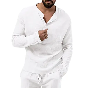 Close-up of men's white crinkle textured long sleeve shirt with henley button neck