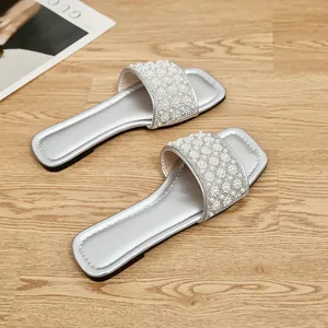 Elegant silver square-toe flat sandals adorned with luxury pearl and rhinestone details
