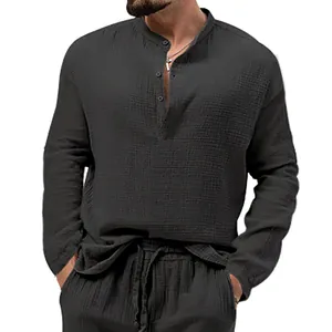 Detail of men's casual long sleeve seersucker shirt with crinkled texture in dark grey.