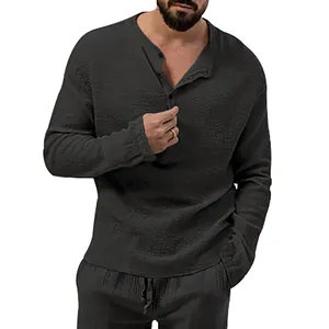Close-up of men's dark grey bubble fabric shirt showing texture and button details