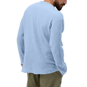 Back view of men's casual light blue seersucker long sleeve shirt with texture detail