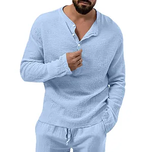 Detailed view of light blue seersucker textured long sleeve button up shirt for men