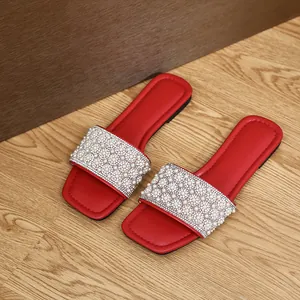 Red square toe flat sandals featuring elegant pearl and rhinestone embellished straps