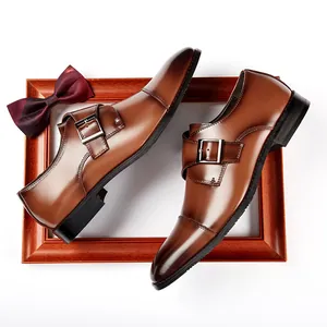 Men's brown leather monk strap shoes on a wooden frame for business and formal wear