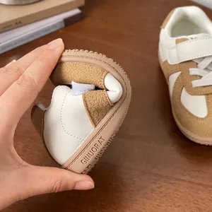 Flexible and soft sole toddler board shoes in white and brown leather for walking